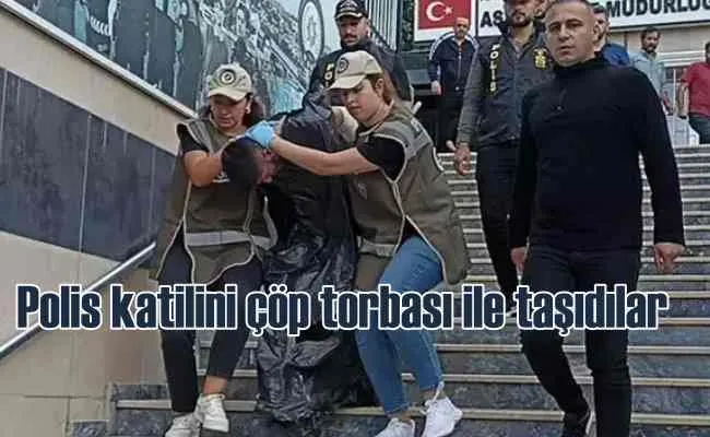 Polis katiline çöp torbası giydirdiler